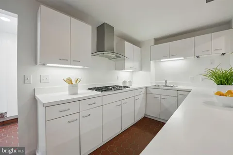 a kitchen with a stove and a refrigerator