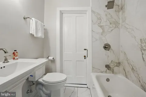 a living room with furniture and large window