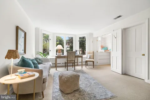 a view of storage and utility room with a window