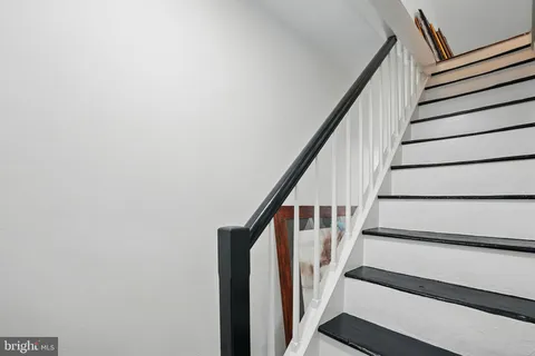 a view of backyard with stairs and trees