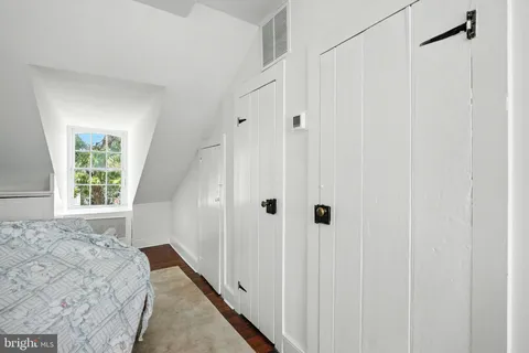a view of a patio with table and chairs and potted plants