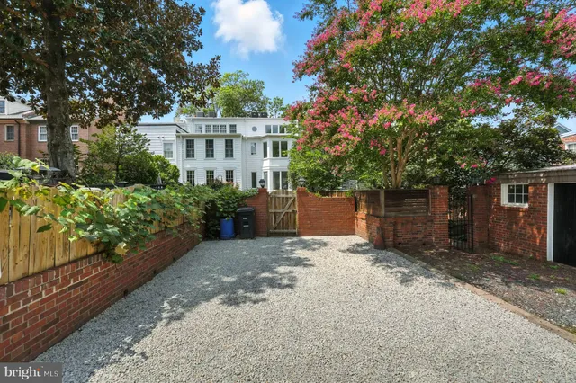 a view of backyard with a green space