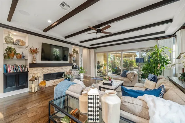 a living room with furniture fireplace and a flat screen tv