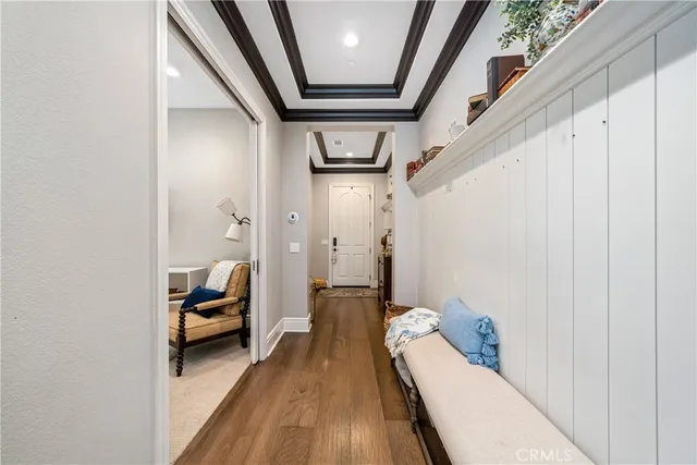 a bedroom with bed and a large window