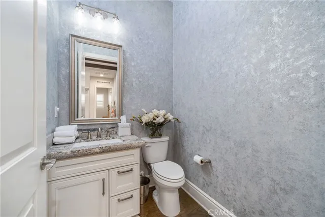 a bedroom with a bed window and flat screen tv