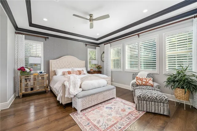 a bathroom with a granite countertop shower a sink and a mirror
