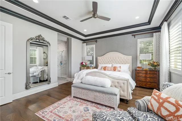 a en suite bathroom with a granite countertop tub sink a window and a shower