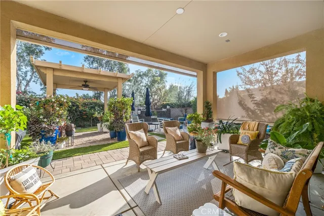 a view of a white house with a yard and plants