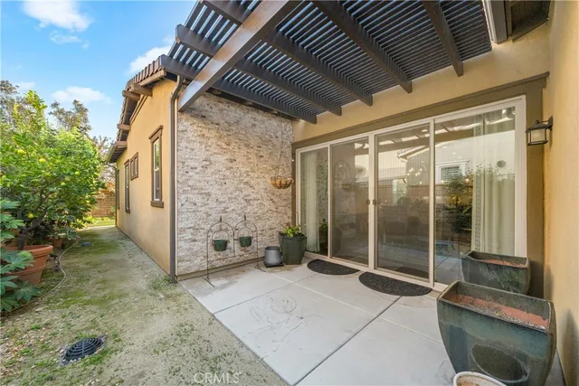 an aerial view of residential houses with outdoor space and parking