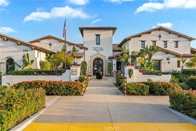 an aerial view of a house with garden space and street view