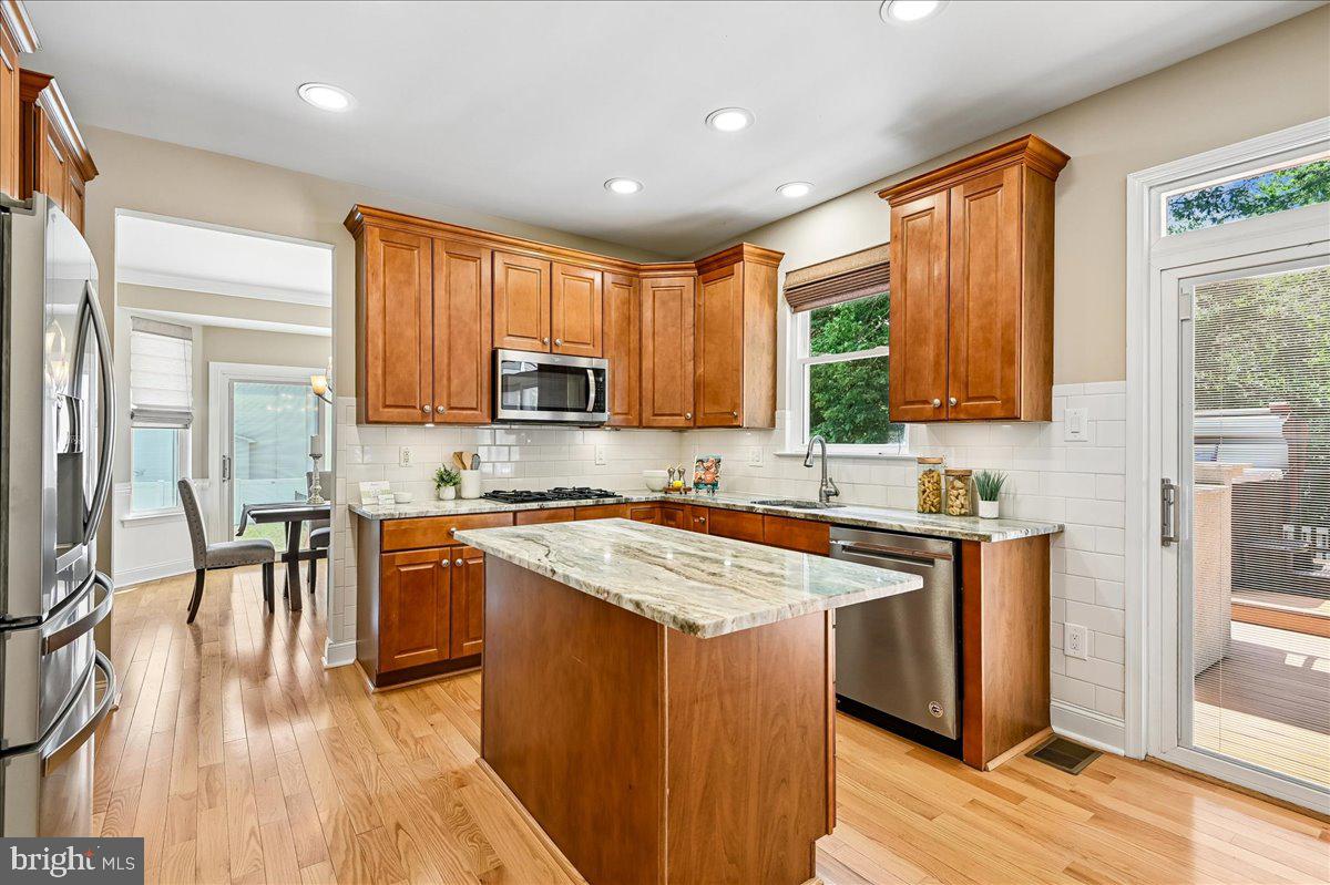 603 Queenstown Road Severn, MD 21144 - Photo 15 of 85 Modern kitchen with warm wood accents.