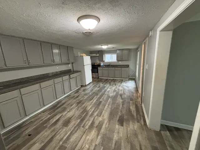 a view of a kitchen with a sink cabinets and window