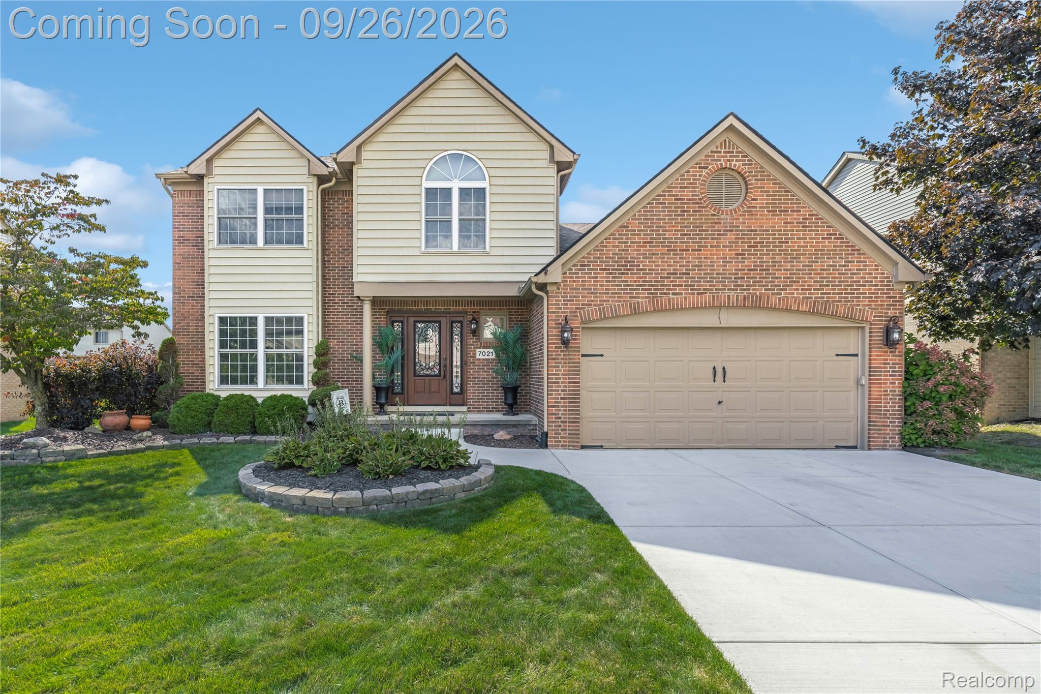 7021 Fox Path Canton, MI 48187 - Photo 40 of 59 Brick and siding exterior with a gabled roofline and arched window details