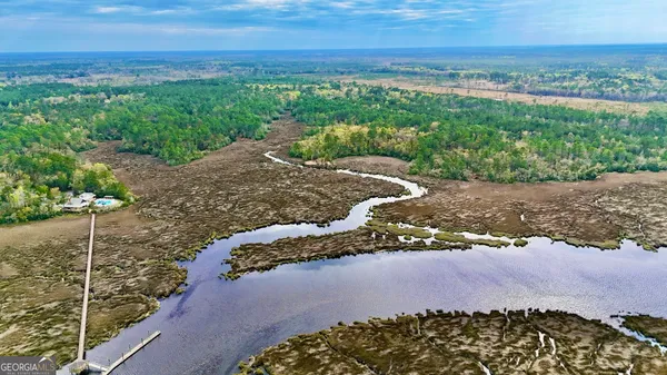 a view of a yard with an ocean view