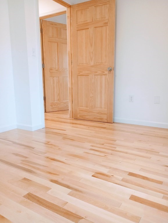 98 Gatewood Road Springfield, MA 01119 - Photo 13 of 21 an empty room with wooden floor