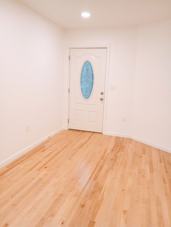 98 Gatewood Road Springfield, MA 01119 - Photo 7 of 21 a view of a room with wooden floor and white walls