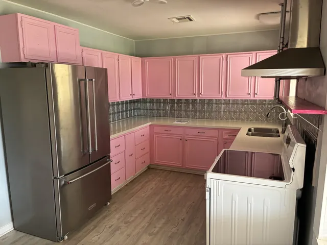 a kitchen with a stove and a sink
