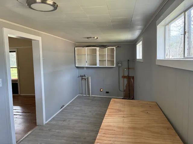 a view of a house with backyard sitting area and garden