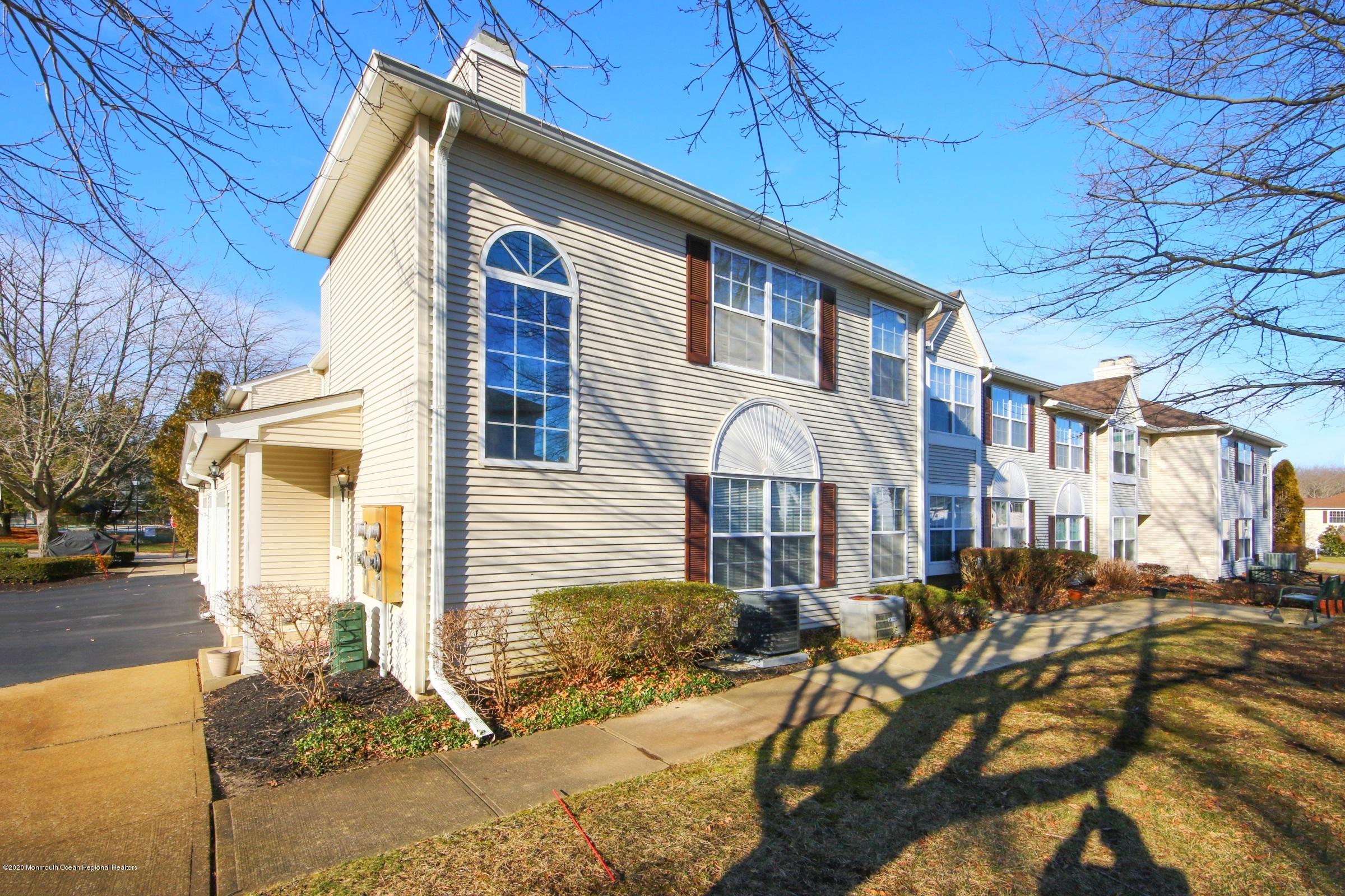 5 Racquet Road Wall, NJ 07719 - Photo 2 of 22 a front view of a house with a yard