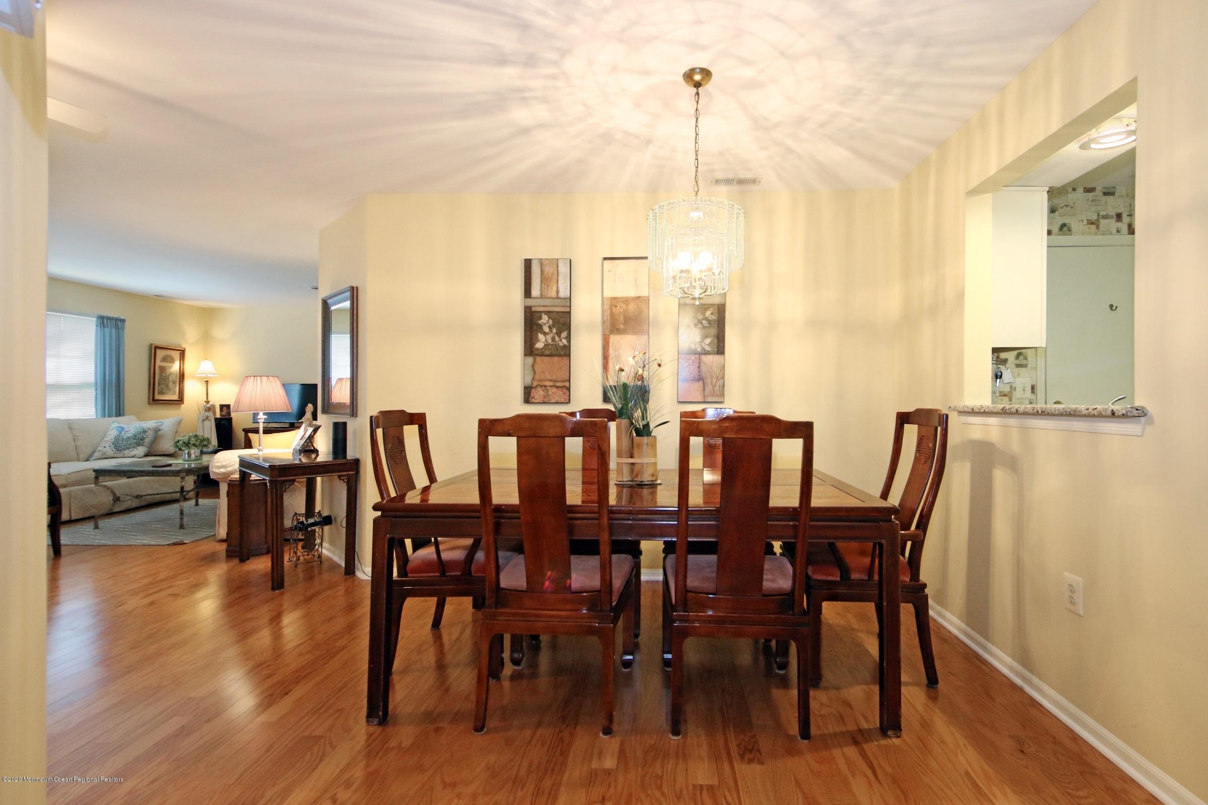 5 Racquet Road Wall, NJ 07719 - Photo 11 of 22 a view of a dining room with furniture window and wooden floor