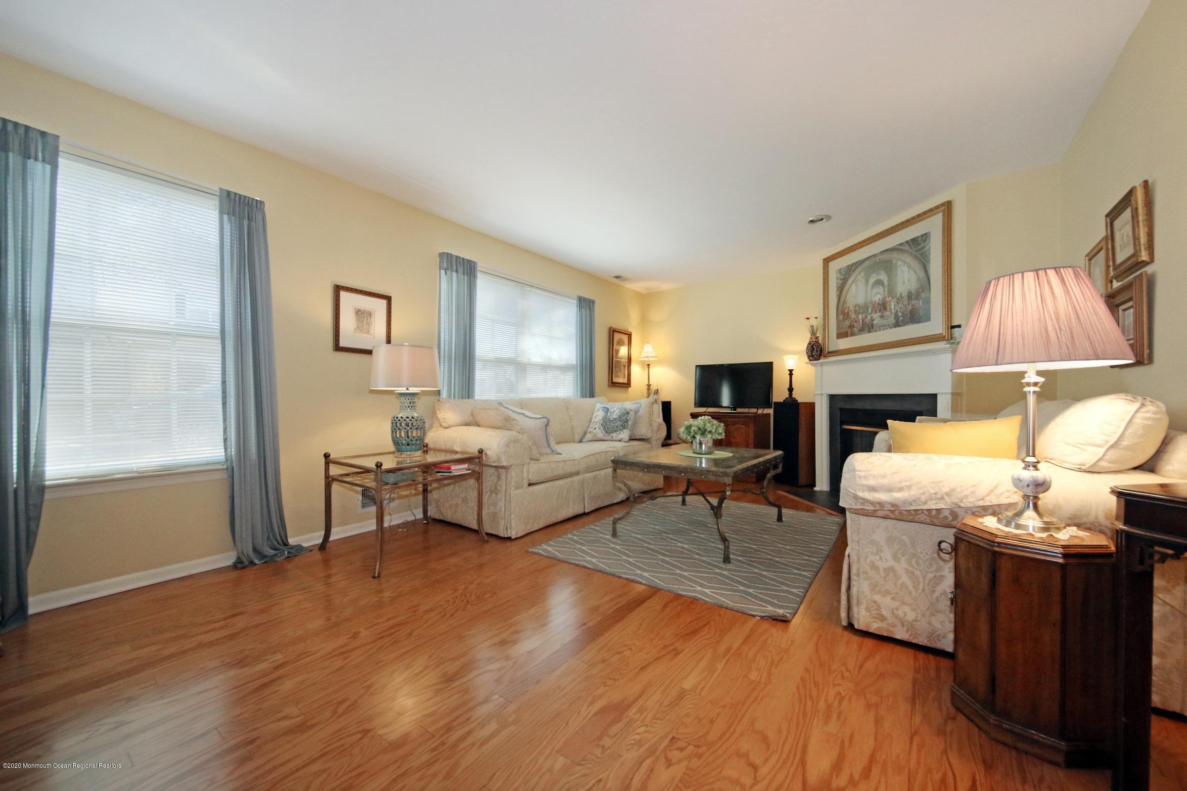 5 Racquet Road Wall, NJ 07719 - Photo 12 of 22 a living room with furniture and a fireplace