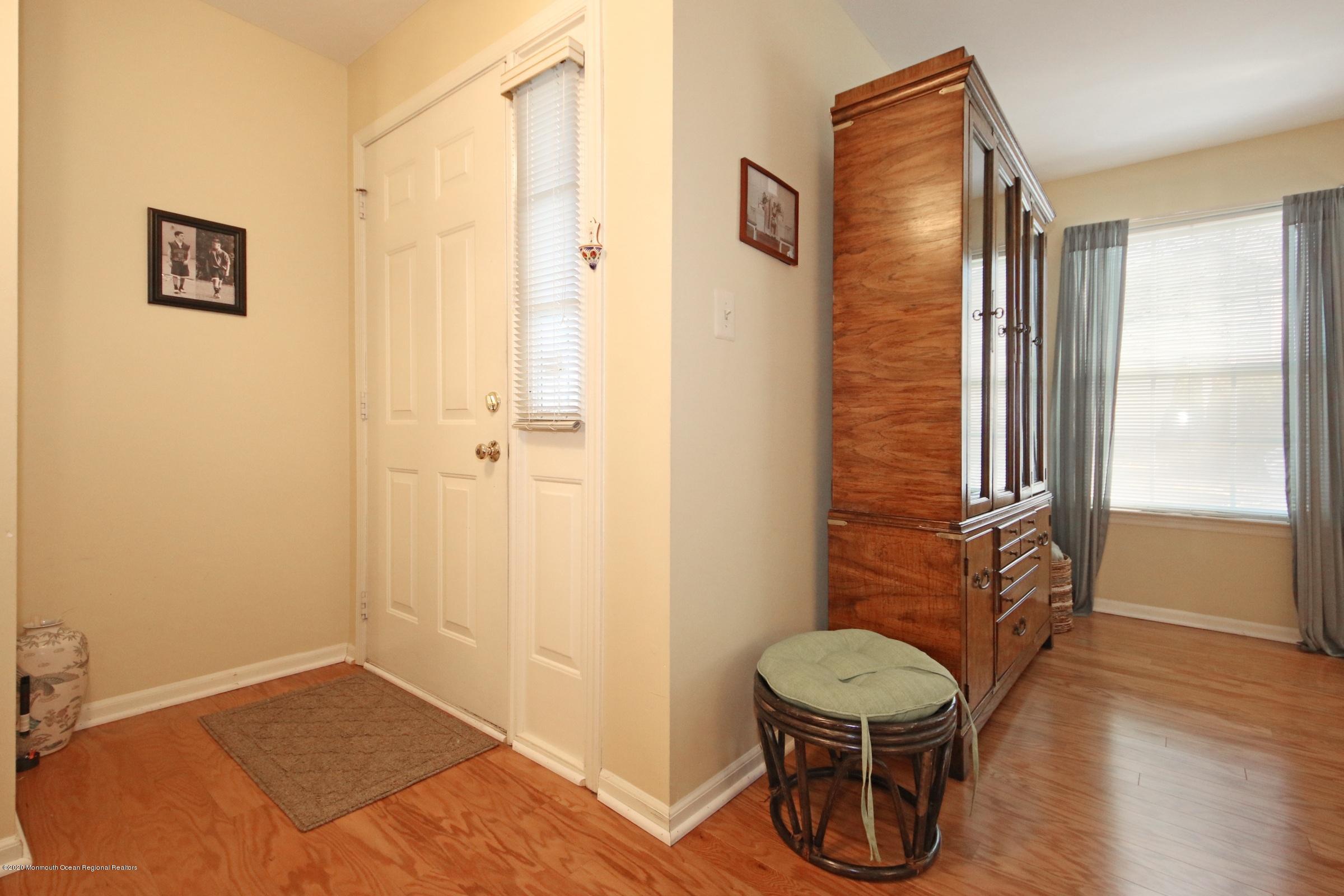 5 Racquet Road Wall, NJ 07719 - Photo 16 of 22 a bathroom with a toilet and a shower