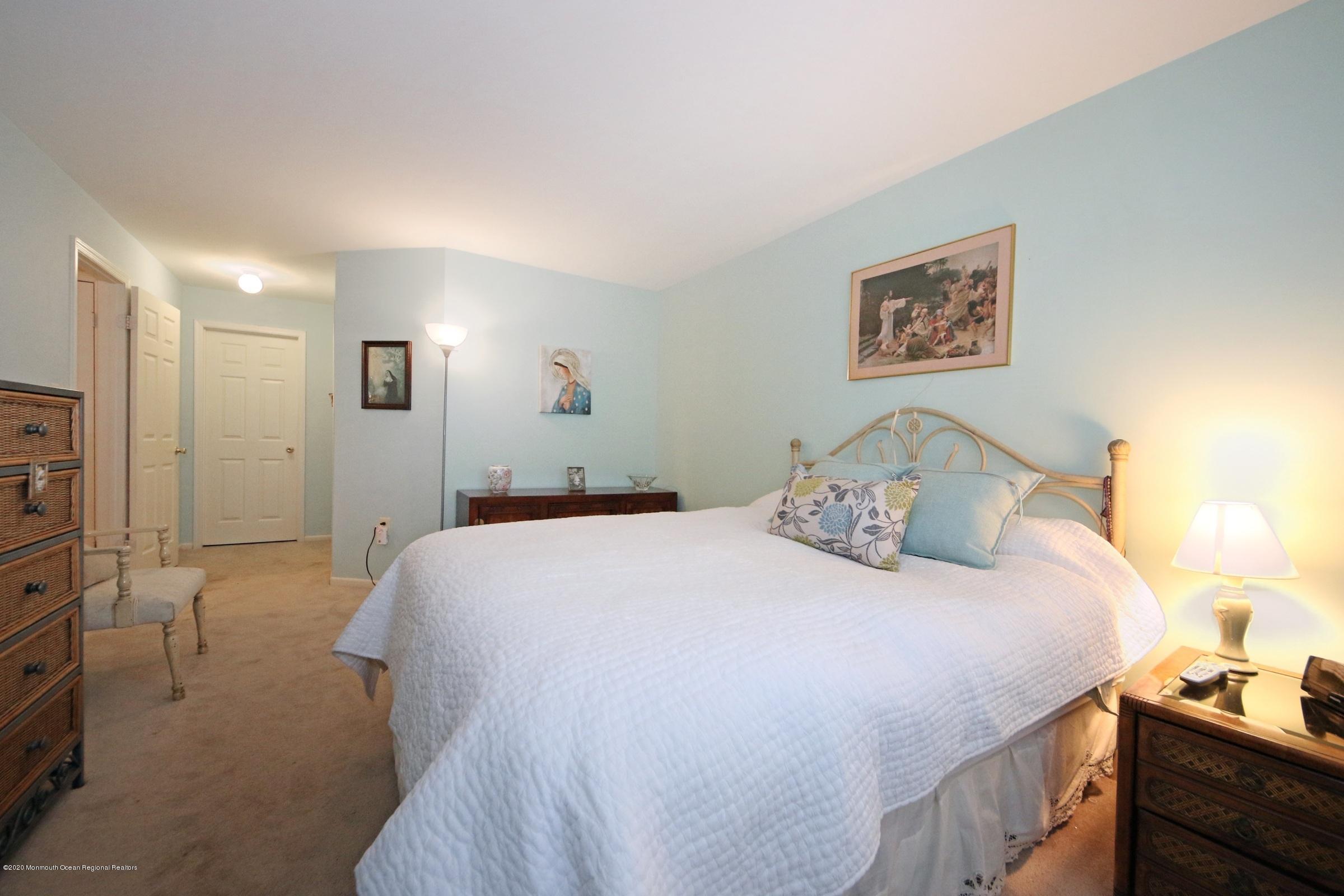 5 Racquet Road Wall, NJ 07719 - Photo 18 of 22 a bedroom with a bed and a cabinets