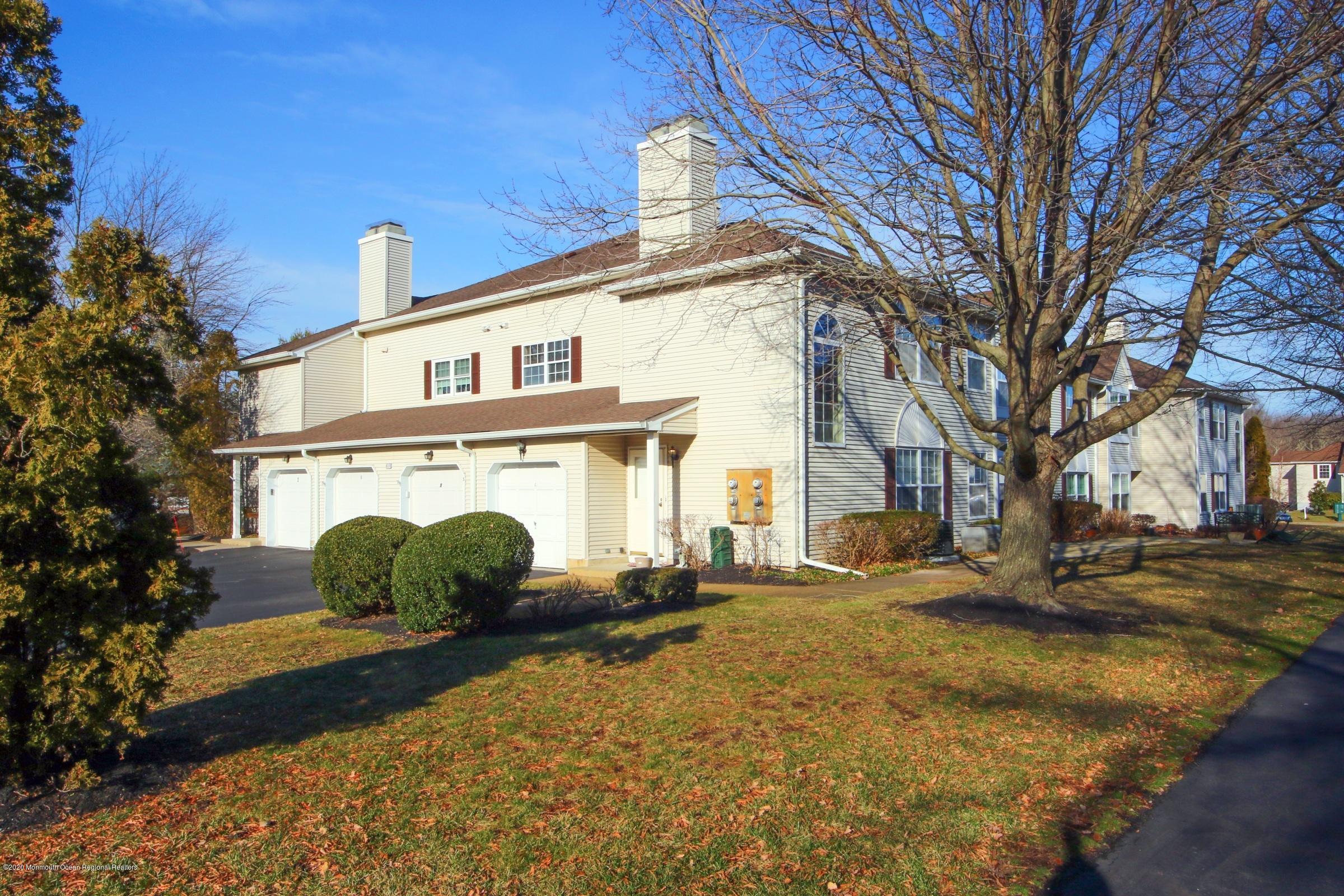 5 Racquet Road Wall, NJ 07719 - Photo 3 of 22 a front view of a house with a yard