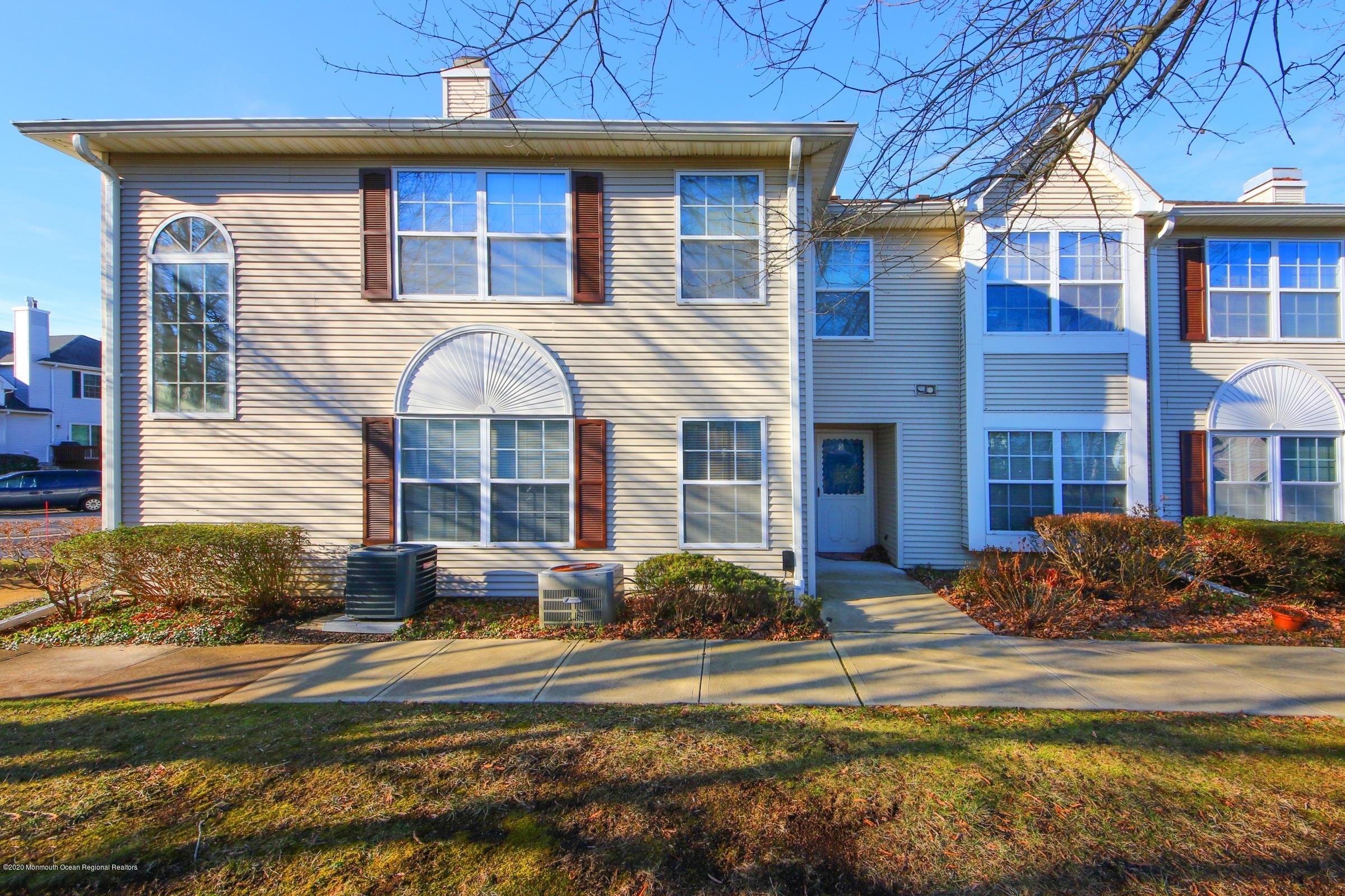 5 Racquet Road Wall, NJ 07719 - Photo 4 of 22 a front view of a house with a yard
