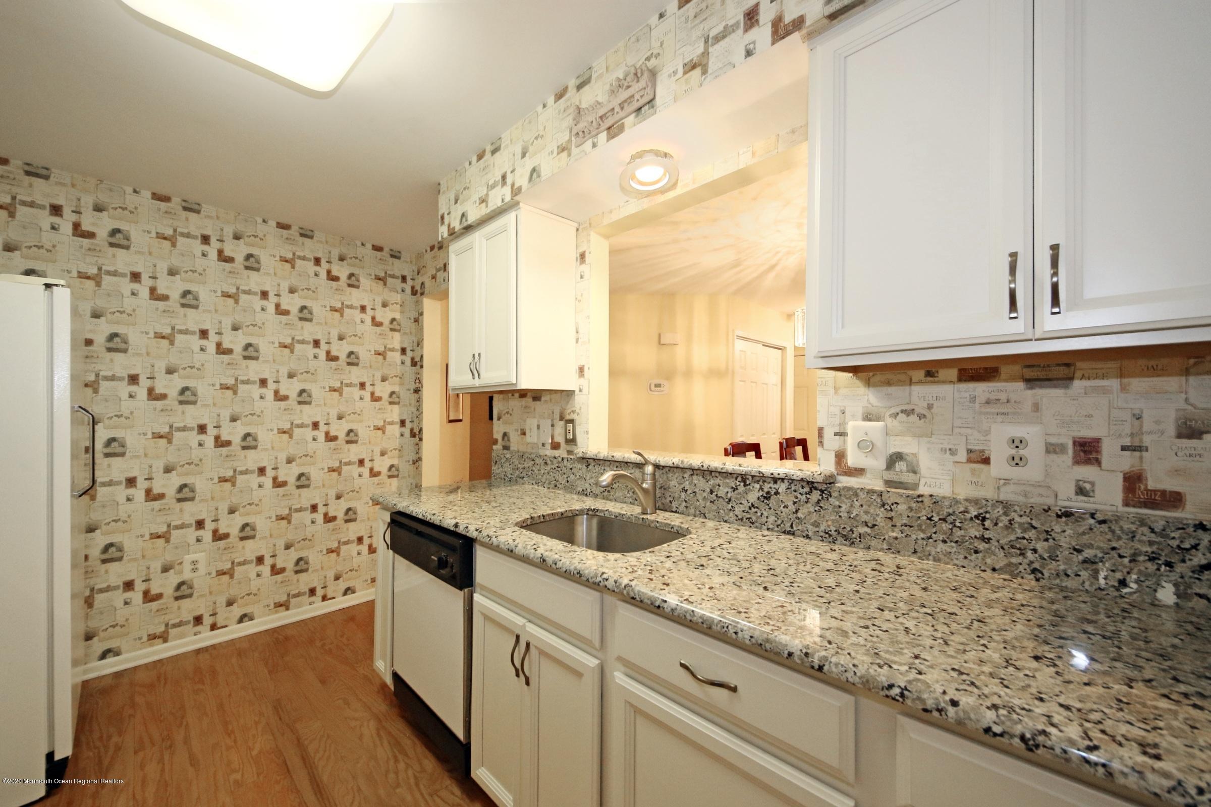 5 Racquet Road Wall, NJ 07719 - Photo 9 of 22 a bathroom with a sink and a shower