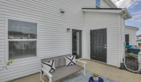 a view of backyard with patio