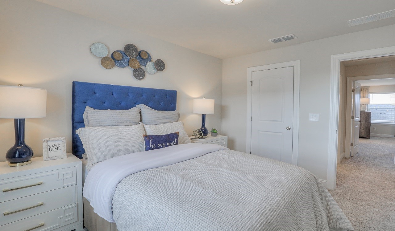 4677 Ridge Bend Drive Nashville, TN 37207 - Photo 10 of 14 a bedroom with a bed and a lamp on dresser