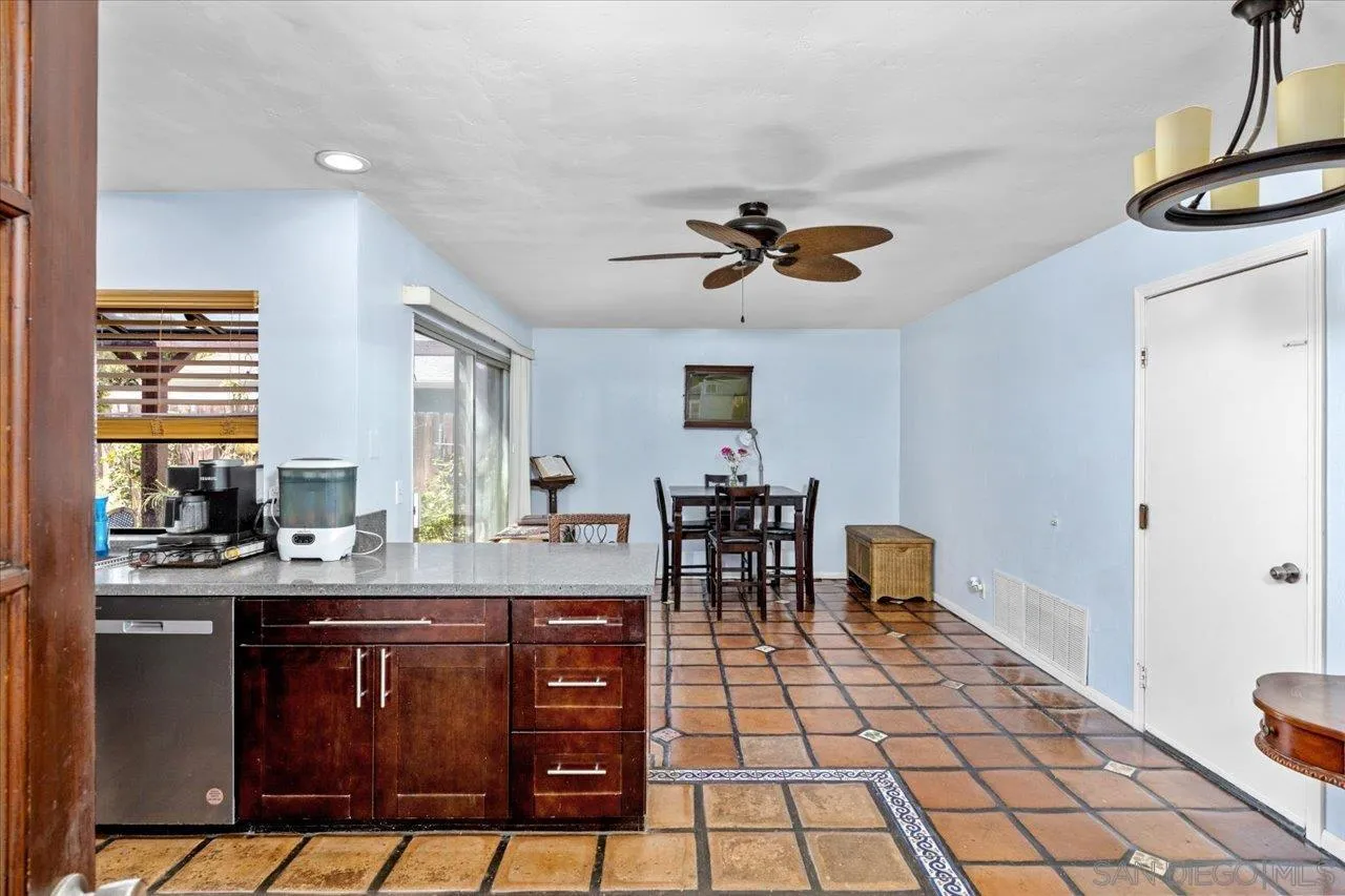 2337 Fallingleaf Road Oceanside, CA 92056 - Photo 9 of 34 a kitchen with a dining table and chairs