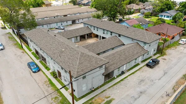 an aerial view of a house with a swimming pool
