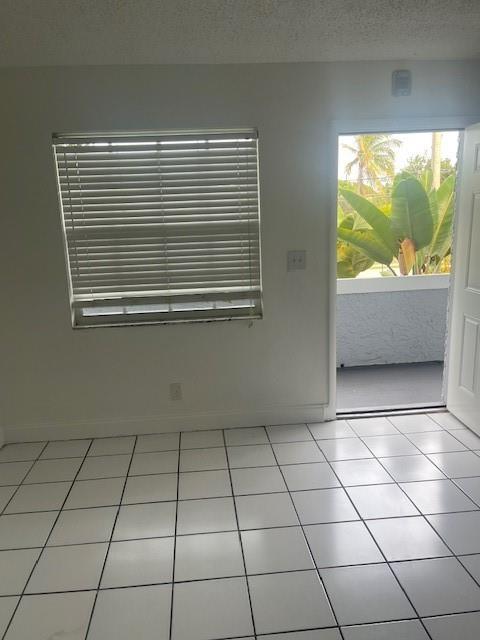 900 Northeast 26th Street, Unit 15 Wilton Manors, FL 33305 - Photo 5 of 9 a view of a room that has a window