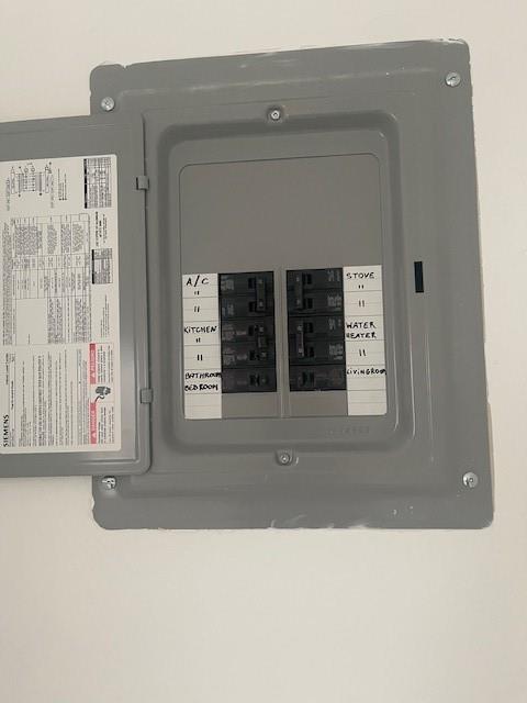 900 Northeast 26th Street, Unit 15 Wilton Manors, FL 33305 - Photo 8 of 9 a black and white photo of a living room