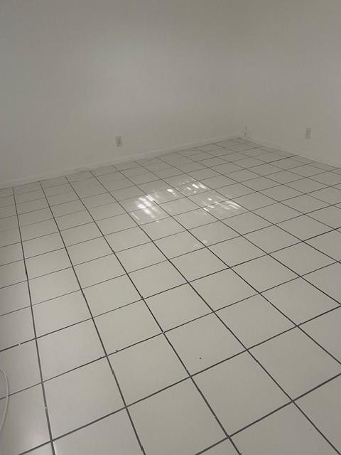 900 Northeast 26th Street, Unit 15 Wilton Manors, FL 33305 - Photo 9 of 9 a view of a garage