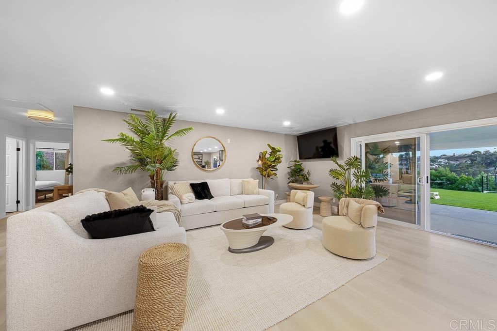 1286 Rippey Street El Cajon, CA 92020 - Photo 11 of 74 a living room with furniture and a potted plant