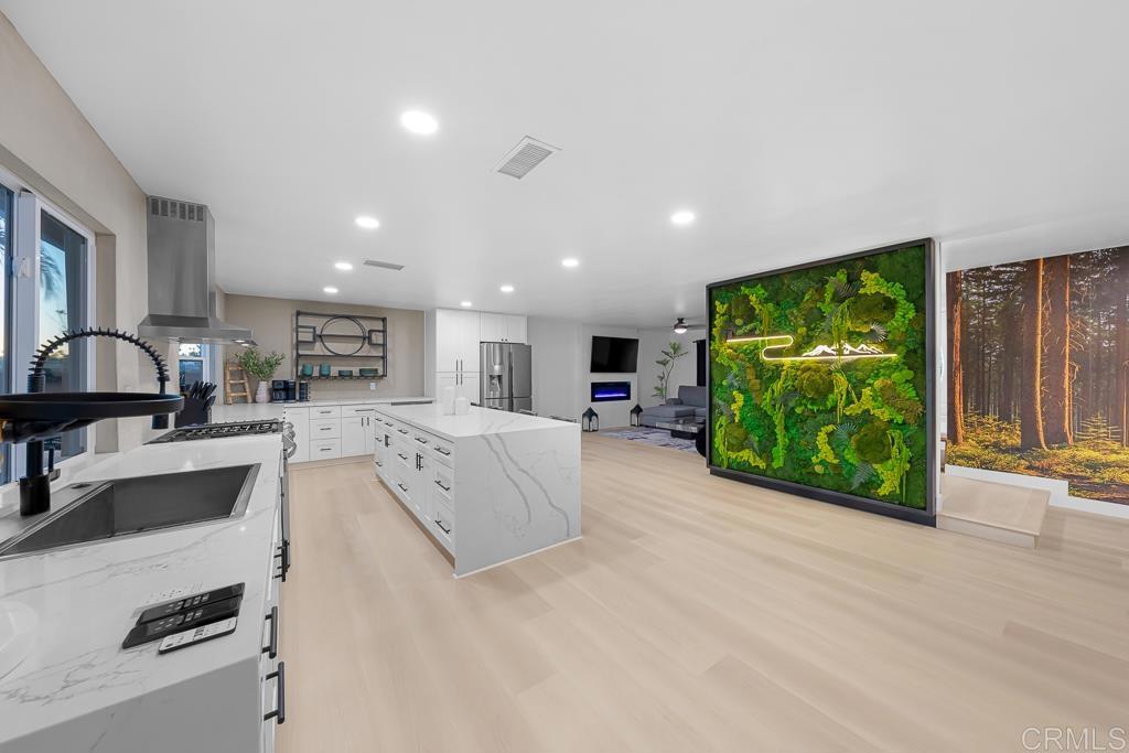 1286 Rippey Street El Cajon, CA 92020 - Photo 14 of 74 a large white kitchen with a large window