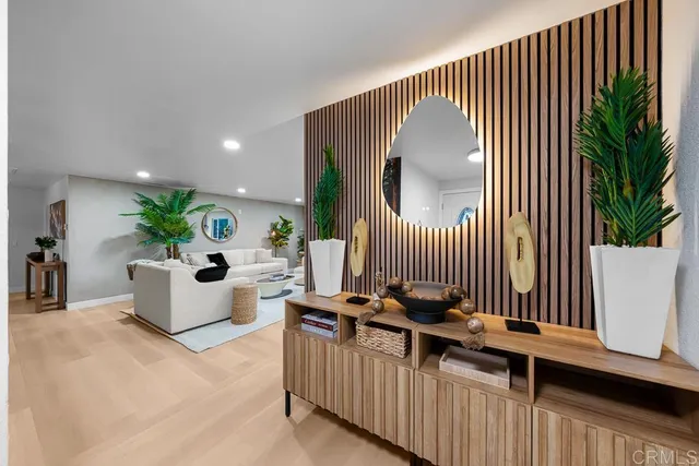 a bedroom with a bed table and a couch