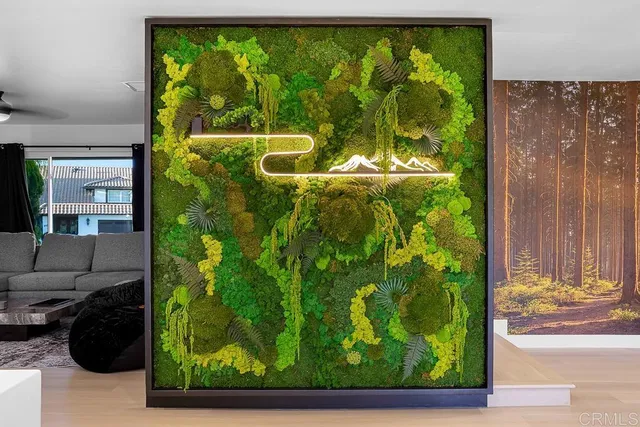 a living room with furniture potted plant and a window