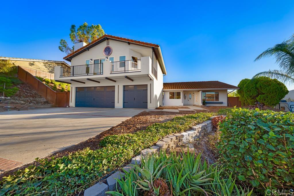 1286 Rippey Street El Cajon, CA 92020 - Photo 2 of 74 a front view of a house with a garden