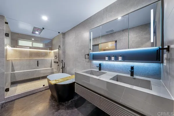 a bathroom with a tub and shower