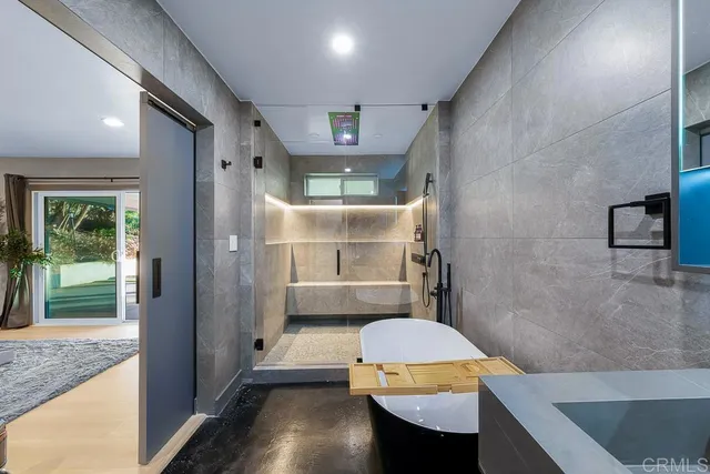 a bathroom with a double vanity sink mirror and shower
