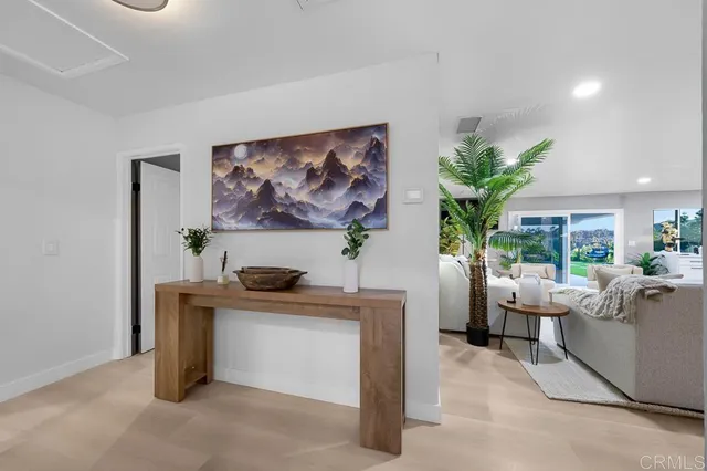 a room with furniture pool table and windows