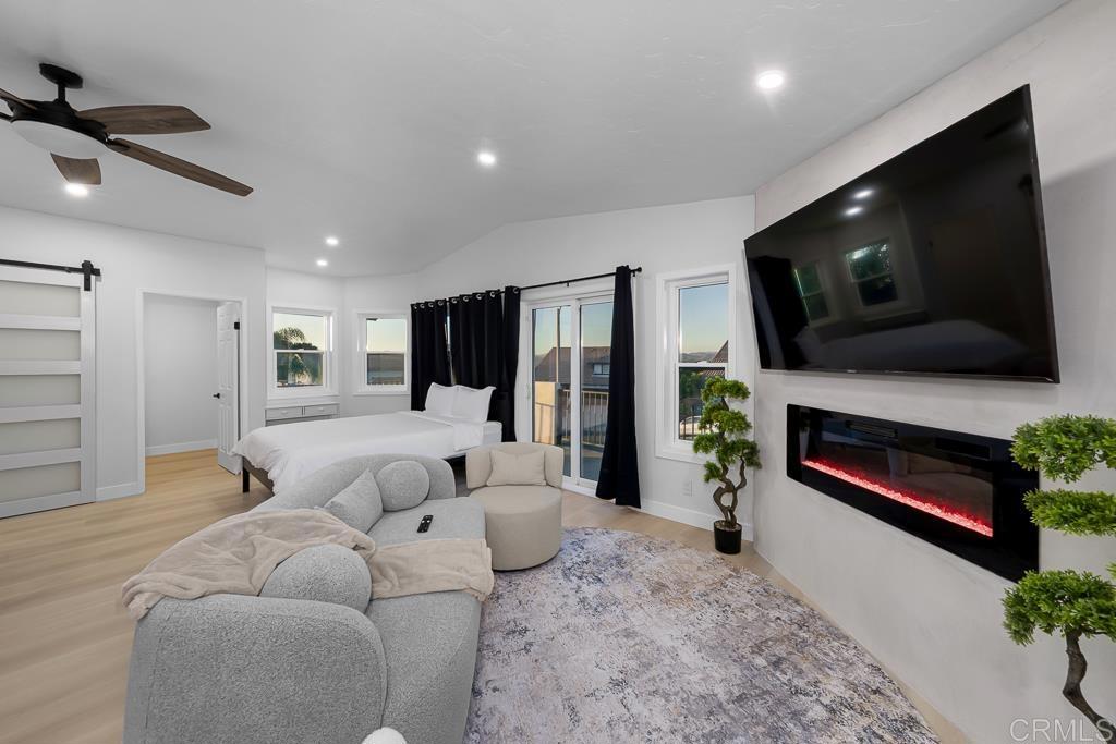 1286 Rippey Street El Cajon, CA 92020 - Photo 34 of 74 a living room with furniture and a flat screen tv