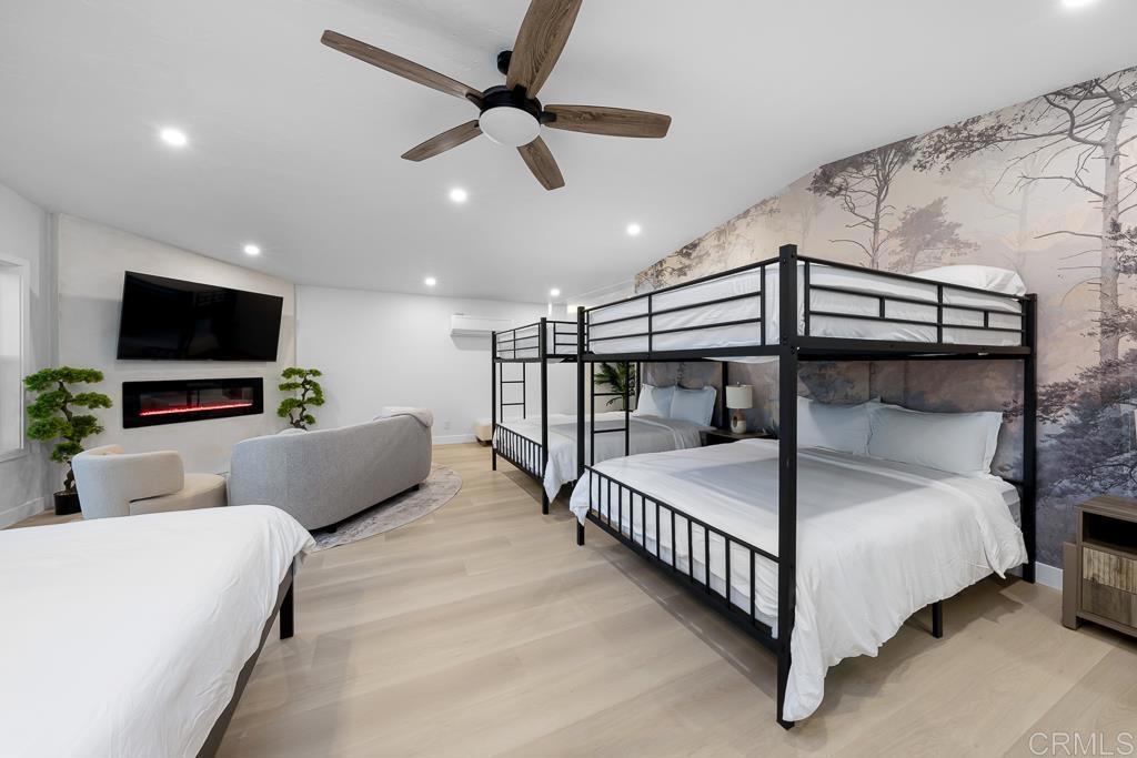 1286 Rippey Street El Cajon, CA 92020 - Photo 37 of 74 a bedroom with a bed and a flat screen tv