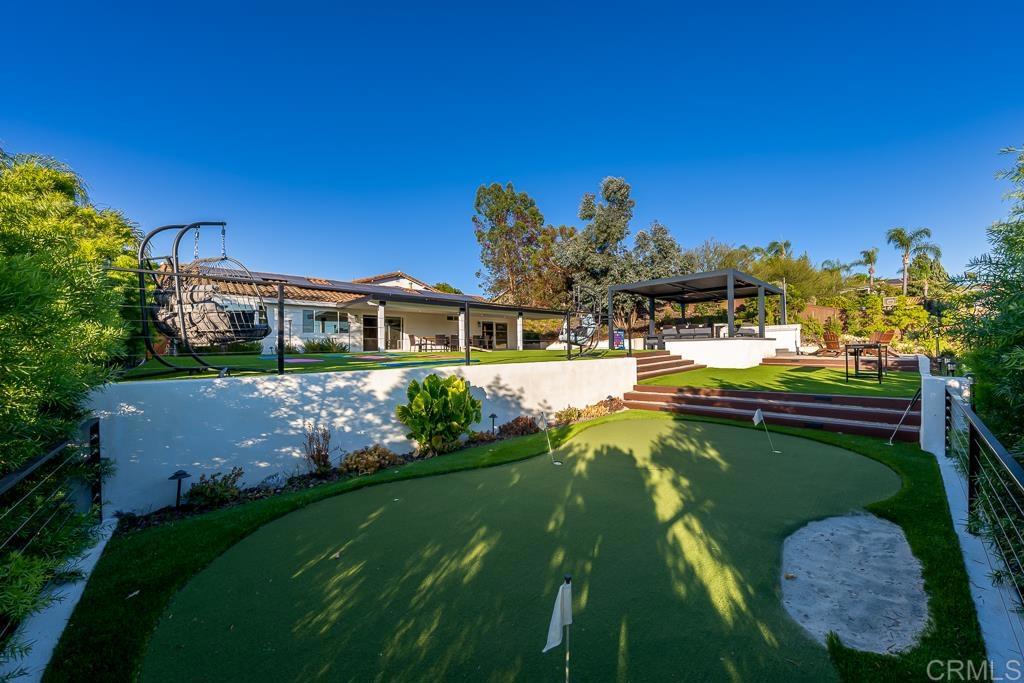 1286 Rippey Street El Cajon, CA 92020 - Photo 53 of 74 a view of a house with swimming pool yard and outdoor seating