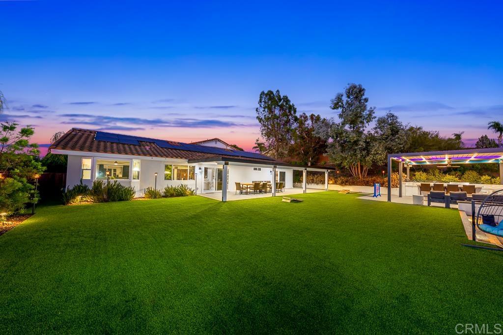 1286 Rippey Street El Cajon, CA 92020 - Photo 70 of 74 a front view of a house with a garden
