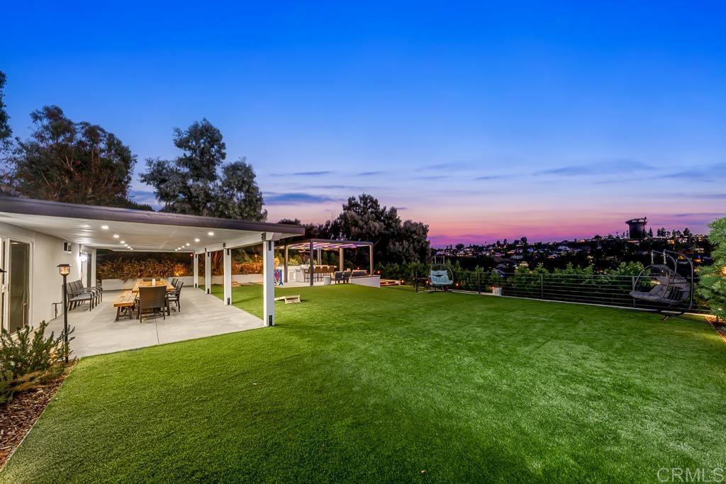 1286 Rippey Street El Cajon, CA 92020 - Photo 71 of 74 a view of a house with backyard and porch